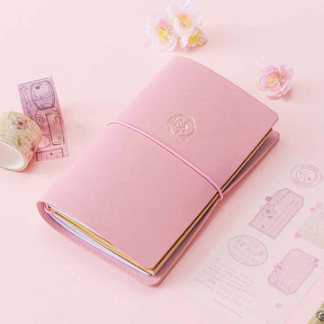 Tsuki ‘Sakura Journey’ Limited Edition Travel Notebook with Tsuki ‘Sakura Journey’ Vintage Journey Washi Tape Set with cherry blossoms on pink background